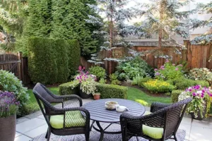 Madcow Tree Service—A beautifully landscaped backyard with trees and plants local to Florissant, MO.